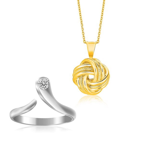 a silver ring and gold necklace pendant